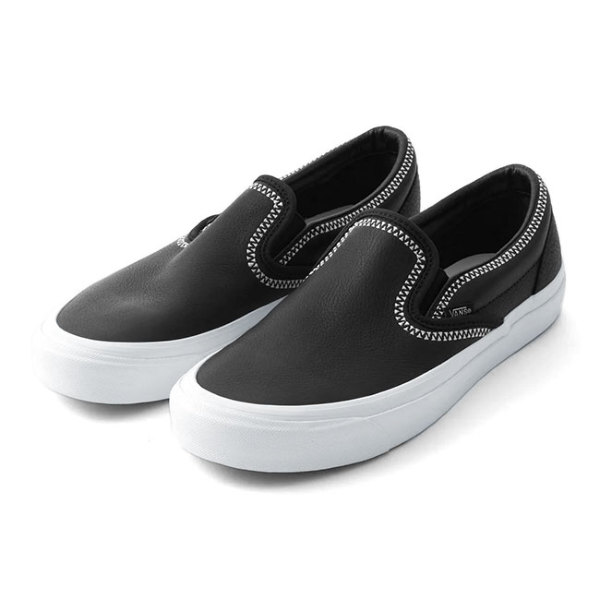 Vans black clearance and white sole